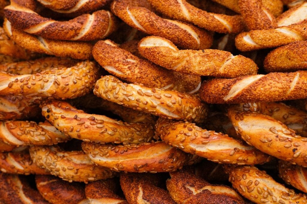 Close-up shot of stacked Turkish simit rings with sesame seeds.