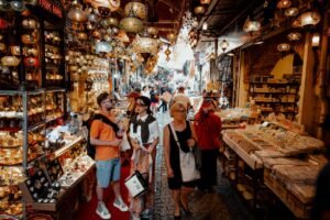 Bustling shoppers explore the colorful Grand Bazaar in Istanbul, a lively historic market full of authentic Turkish items.