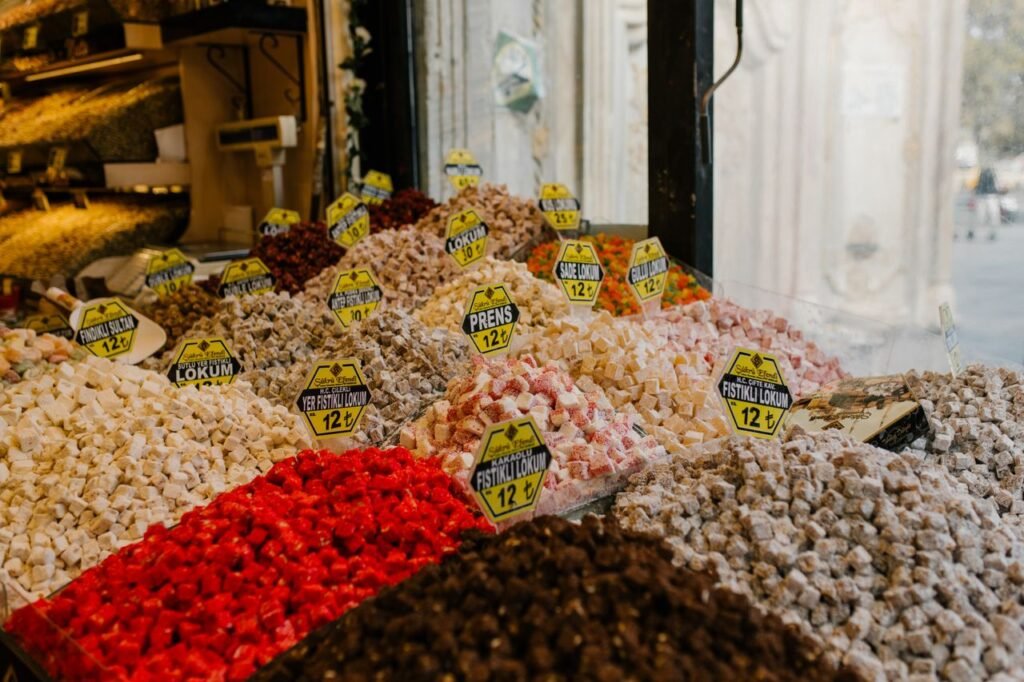 Colorful Turkish delight assortments on display at a bustling Istanbul market stall.