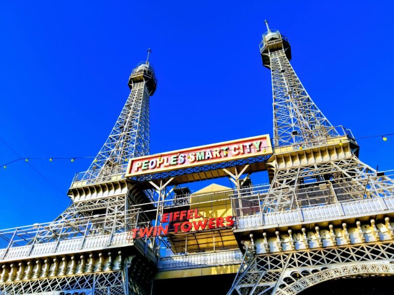 A modern replica of Eiffel Towers in Bhopal's People's Smart City under a clear blue sky.